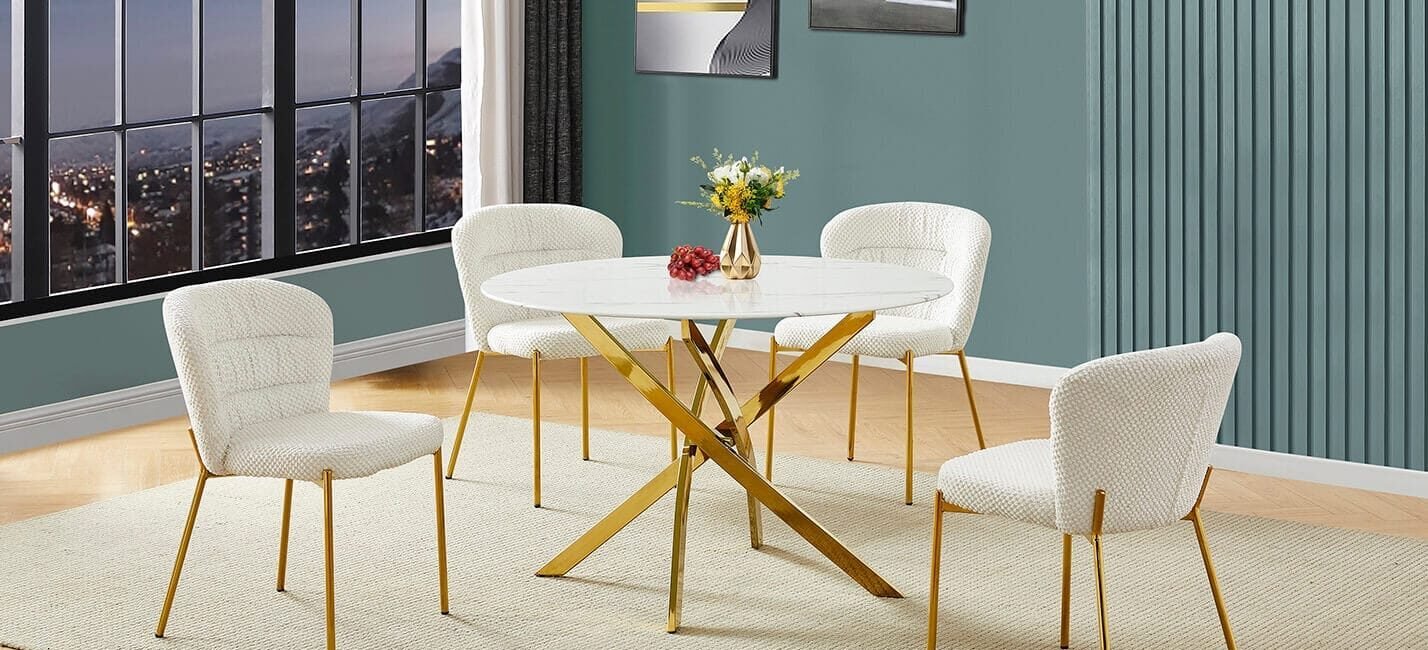 Round faux-marble dining set with gold cross-leg base and fluffy fabric chairs.