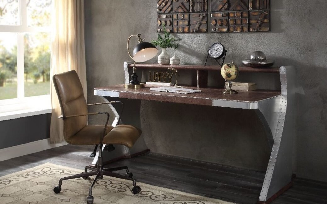 Brancaster executive writing desk with top-grain leather top and riveted aluminum sled base.