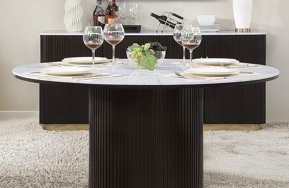 Clayten round dining table with marble-look top and espresso pedestal base.