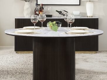 Clayten round dining table with marble-look top and espresso pedestal base.