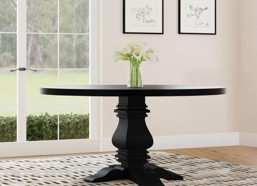 Florence 60-inch round black dining table with sculpted pedestal base.
