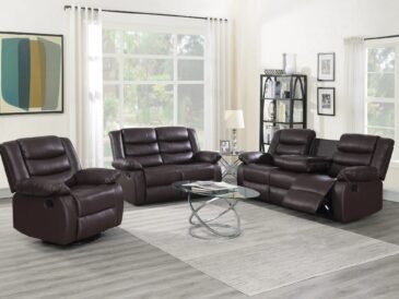 Brown reclining sofa and loveseat set with drop-down table and cup holders in modern living room setting.