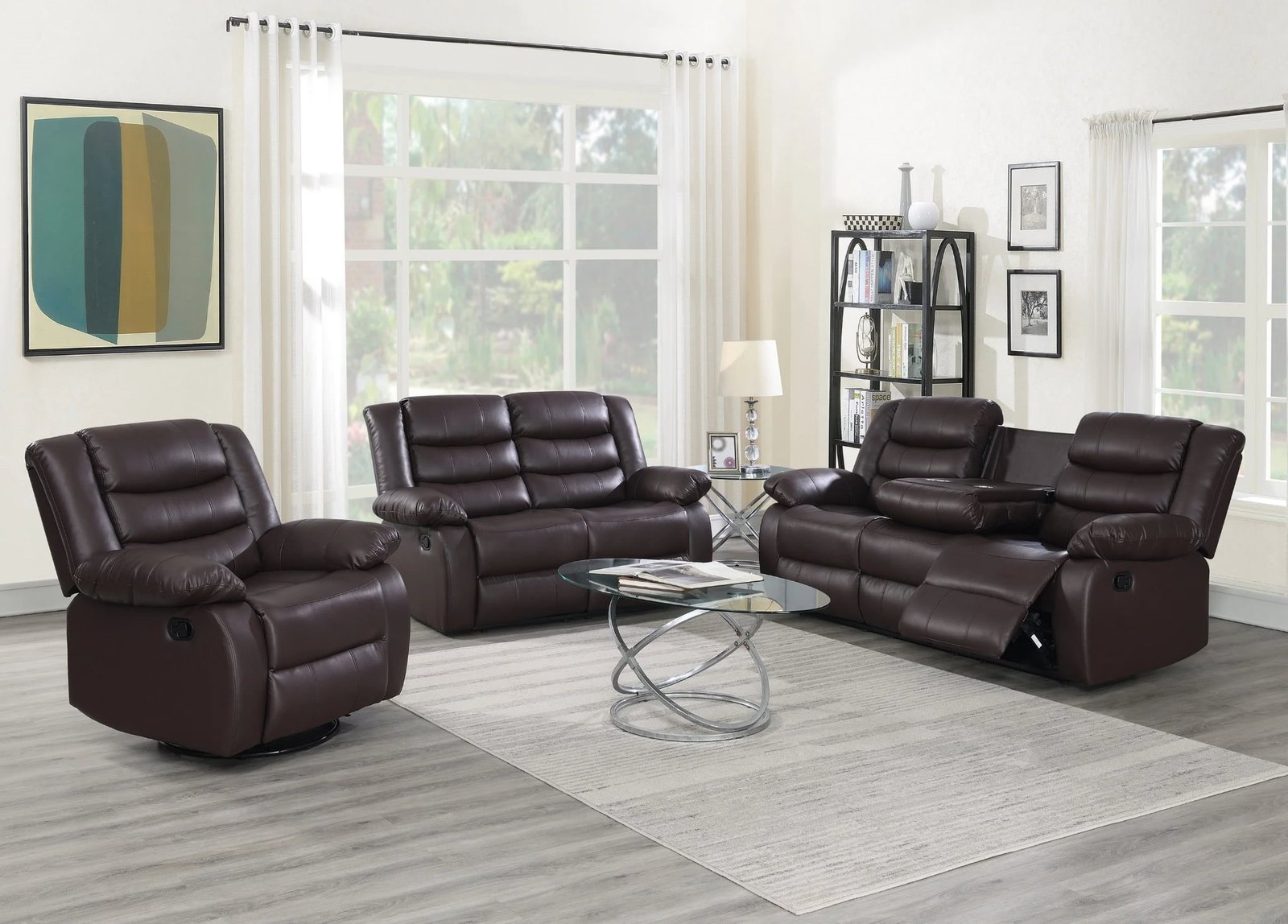 Brown reclining sofa and loveseat set with drop-down table and cup holders in modern living room setting.