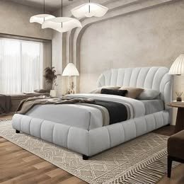 Modern cream upholstered platform bed in teddy bouclé fabric with cloud-inspired curves and minimal neutral bedroom décor.