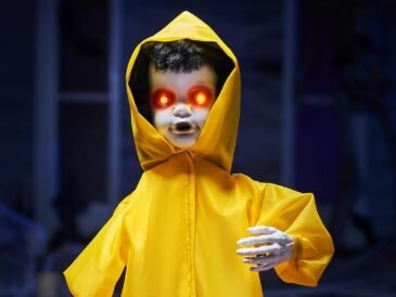 JOYIN 34" Raincoat Boy – motion-activated Halloween decoration for haunted houses and lawns.