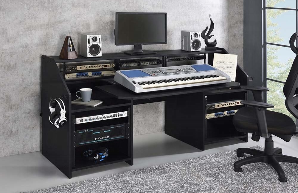 Black modern studio music desk with shelves and earphone racks.