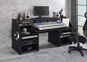 Black modern studio music desk with shelves and earphone racks.