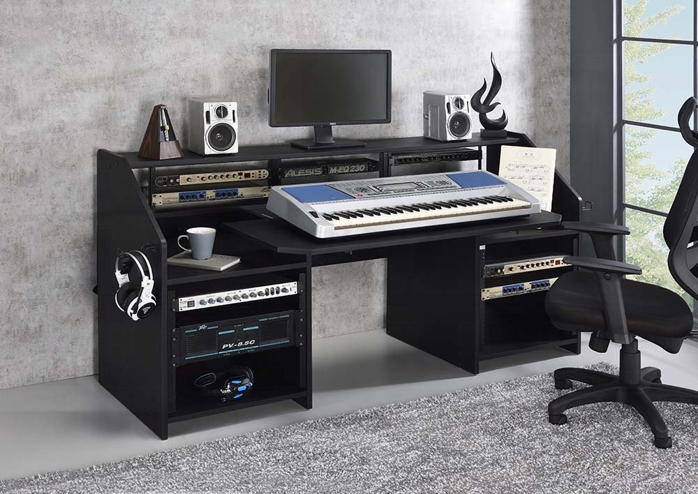 Black modern studio music desk with shelves and earphone racks.