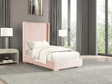 Art Deco glam pink bed with tall wingback headboard and vertical channel tufting in blush chenille fabric.