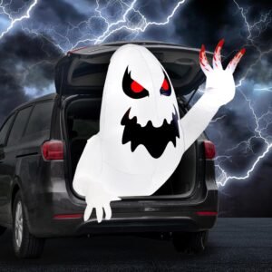White inflatable Halloween ghost glowing with LED lights, emerging from car trunk with red eyes.