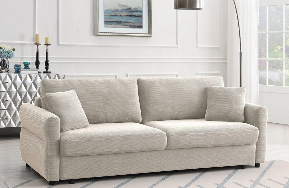 Beige modern farmhouse sofa with pull-out sleeper bed and neutral living room décor.