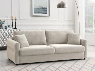 Beige modern farmhouse sofa with pull-out sleeper bed and neutral living room décor.