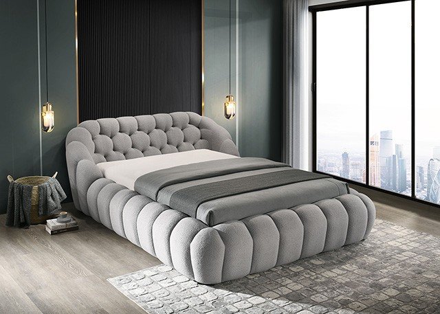 Gray chenille upholstered contemporary bed with low platform frame and minimalist design in modern bedroom setting.