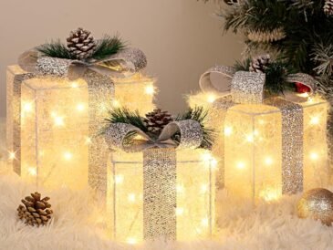 Set of three silver tinsel Christmas gift boxes with warm white LED lights and decorative bows, perfect for indoor and outdoor holiday décor.