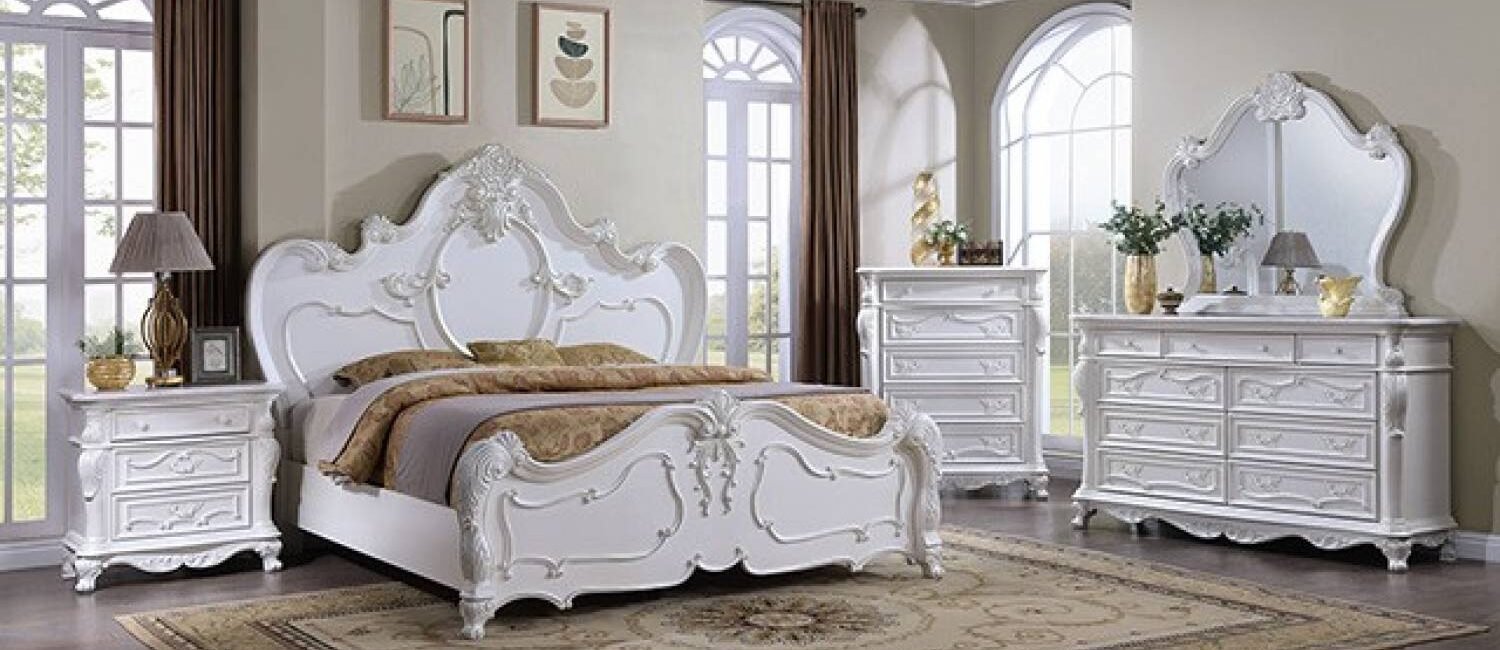 Pearl finish vintage classic glam bedroom set with ornate motifs and decorative detailing.