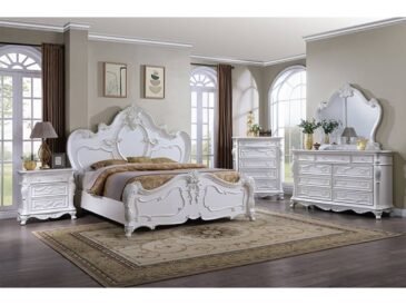Pearl finish vintage classic glam bedroom set with ornate motifs and decorative detailing.