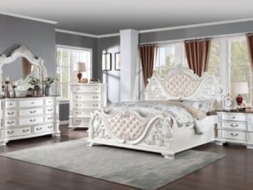 Luxury pearl white tufted bed with ornate baroque carvings and marble-topped nightstands from the Esparanza Vintage Glam Bedroom Collection.
