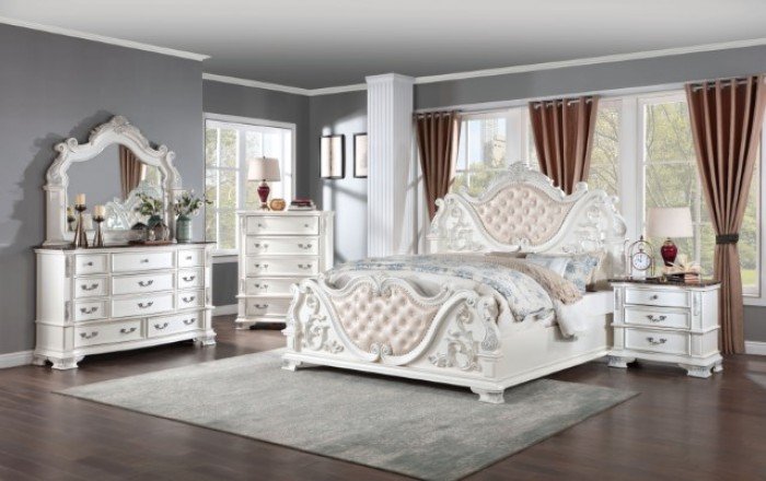 Luxury pearl white tufted bed with ornate baroque carvings and marble-topped nightstands from the Esparanza Vintage Glam Bedroom Collection.