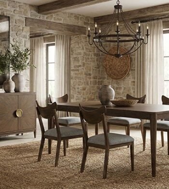 Mid-century modern walnut dining set with rectangular table and upholstered chairs in a warm, minimalist dining room