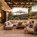 Upscale California patio with cushioned outdoor seating, pergola lights, large planters, umbrella, and a textured outdoor rug.